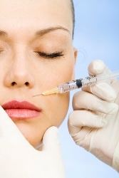 Woman getting an injection on her upper lip