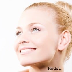Close-up of beautiful woman face. On white background