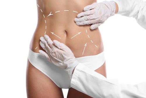 surgeon examining female body before plastic operation-img-blog