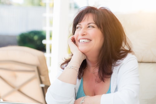 attractive middle aged woman smiles on the patio-img-blog