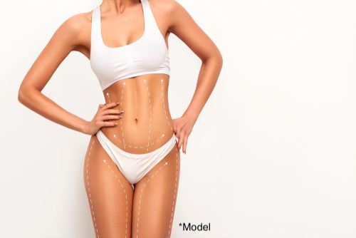 Woman considers liposuction to remove stubborn deposits of fat.